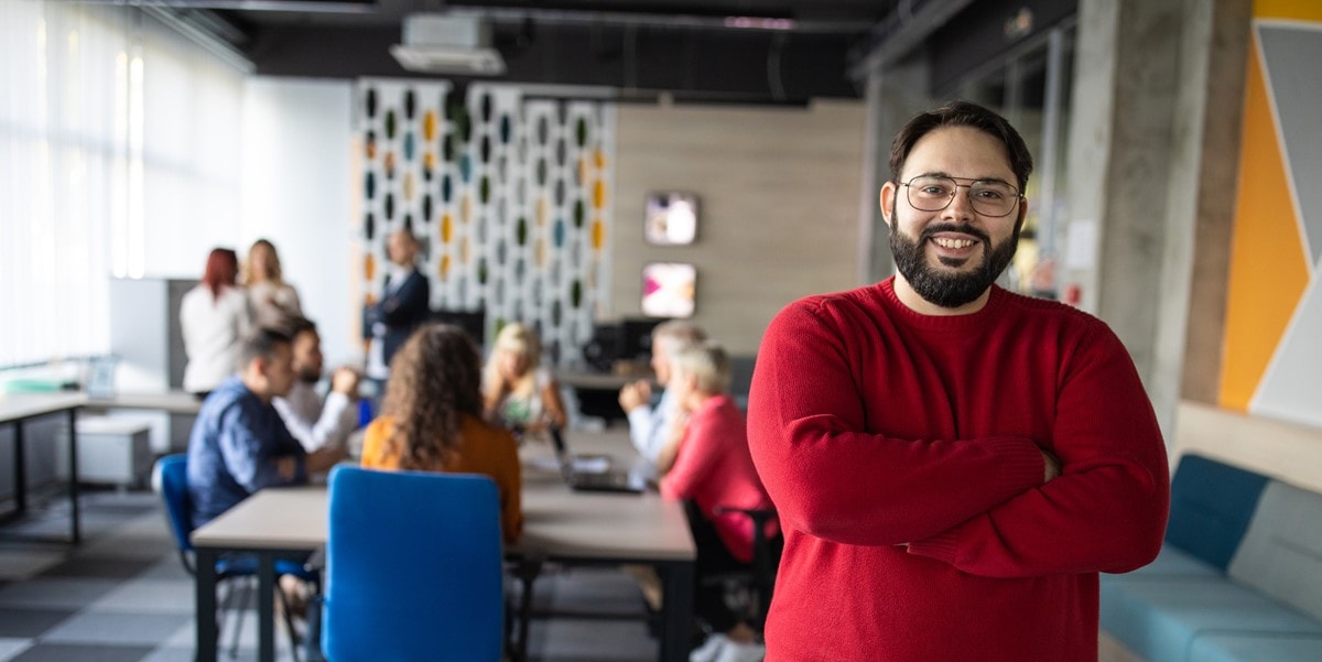 man in office, smiling